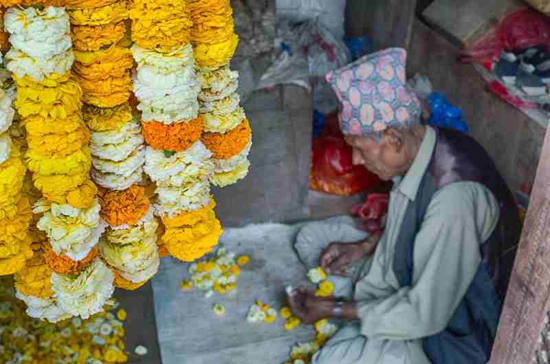 Napal Man making Flower wreaths